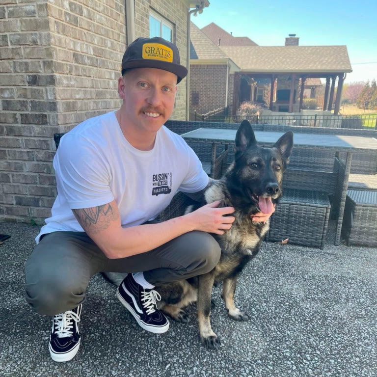 Jared Johnson with a client's dog