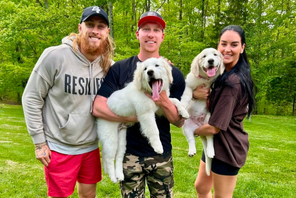 Happy family with their trained dogs
